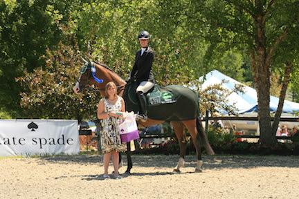 Amanda Starbuck and Carte Blanche are presented with winner's awards from Katie Collard of Kate Spade following the 0,000 Kate Spade Welcome Stake, presented by Manchester Designer Outlets, at the Vermont Summer Festival. (Photo: David Mullinix Photography)