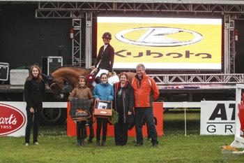 Amy Millar is presented as the winner of the $50,000 Zucarlos Grand Prix, presented by Kubota Canada and Stewart’s Equipment. Photo by Ben Radvanyi Photography