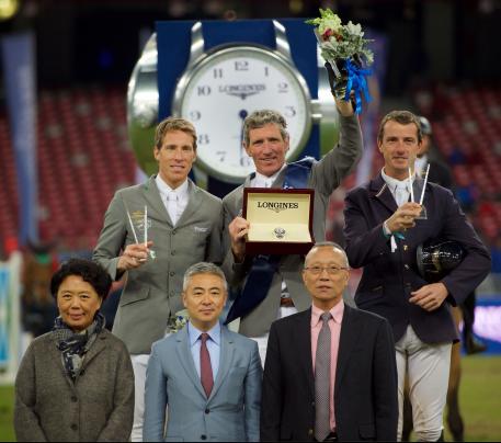 The prize-giving ceremony of the Longines Grand Prix with Henrik von Eckermann, Ludger Beerbaum and Gregory Wathelet on the podium and Jing Li, CEO of Dashing Equestrian, Dennis Li, vice-president of Longines China, and Li Nianxi, chief secretary of the Chinese Equestrian Association, in the front.