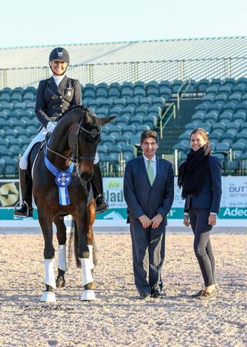 Adrienne Lyle and Horizon in their winning presentation with judge Cesar Torrente and Cora Causemann of AGDF.