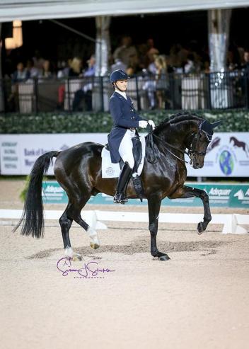 Adrienne Lyle (USA) and Salvino perform a freestyle under lights for the first time, and are rewarded with over 78% - including a 79% score from Britain's Peter Storr. (Photo: SusanJStickle)