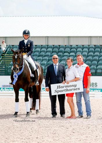 Allison Brock and Rosevelt in their presentation ceremony with judge Peter Storr (GBR), Cora Causemann of AGDF, and Allyn Mann of Adequan®. 