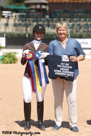 Angela Peavy is honored with the 2017 USEF Para Equestrian Dressage National Championships presented by Deloitte with judge Kristi Wysoki (USA).