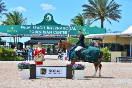 David Blake and Binkie are presented with the Noble Outfitters Signature Bag Collection by ringmaster Christian Craig in the awards ceremony.