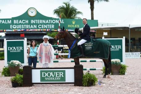 Eduardo Menezes in his presentation ceremony with ring master Steve Rector and Wendy Manganelli of Dover Saddlery.