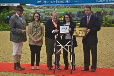 Elizabeth Johnson accepts the award for USHJA Zone 5 Horseman of the Year. 