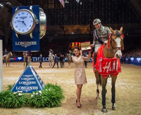 Emanuel Gaudiano (ITA) riding Admara are presented with a Longines watch by Katrina Jones, Branding Director, Longines Uk and Ireland