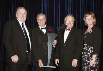 John Weir, Craig Collins and Bob Carey of Equestrian Management Group accept the Jump Canada Hall of Fame Award in the category of Builder (Organization) from Canadian Olympian Beth Underhill.