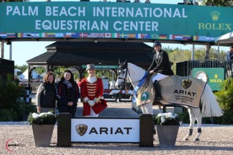Eric Lamaze and Check Picobello Z in their winning presentation with Carlene Ziegler of Artisan Farms, Kasey Mowery of Ariat International, and ringmaster Christian Craig.