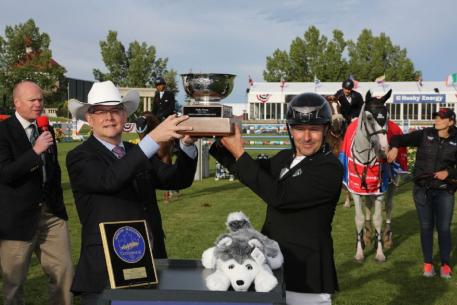 Eric Lamaze raises the Husky Energy Cup trophy with Rob Peabody, Chief Operating Officer, Husky Energy.  