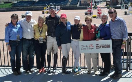 Shelley Page, Jim Cogdell, Bernadette Cogdell, Doug Payne, Marilyn Little, Kim Severson, Judy Carpenter of Lucky Clays Farm, Sharon Decker, and Mark Bellissimo stand together in the FEI CIC 3* awards presentation.
