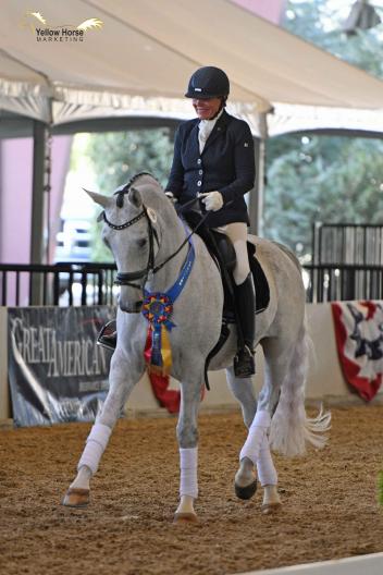 Fifty years after her first CDS Championship Show in 1968, Hilda Gurney earned yet another championship title by topping a hard-fought Great American/USDF Third Level Freestyle class with 72.833% aboard Lotta Silver.