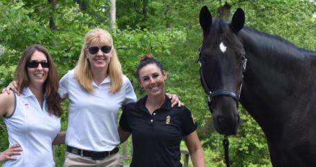 Malinda Ferko of Triple Crown, Kelly Payne of Triple Crown, and U.S. Dressage National Grand Prix Champions Kasey Perry-Glass and Goerklintgaards Dublet at The Dutta Corp. U.S. Dressage Festival of Champions 