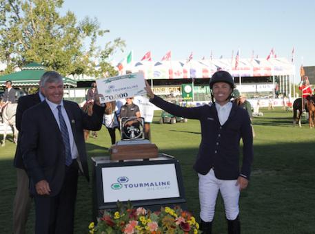 Kent Farrington accepts the winning prize from Mike Rose, Director & Chairman, President & CEO, Tourmaline Oil Corp  
