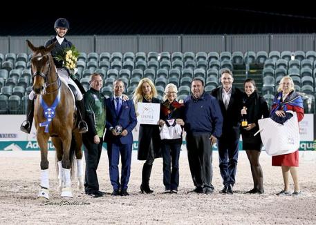 Laura Graves and Verdades are joined in their winning presentation by Allyn Mann of Adequan®, judge Lee Tubman, representatives from the U.S. PRE Association, Cora Causemann of AGDF, and FEI Chief Steward Elisabeth Williams.