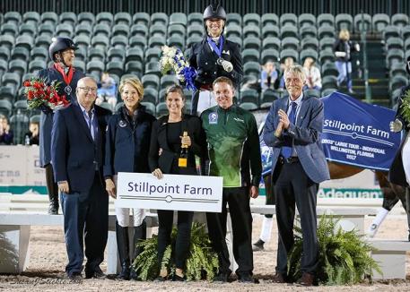 The FEI Grand Prix Freestyle CDIO 3* podium with winner Megan Lane, Equestrian Sport Productions President Michael Stone, Tuny Page of Stillpoint Farm, Cora Causemann of AGDF, Allyn Mann of Adequan®, and judge Thomas Lang.