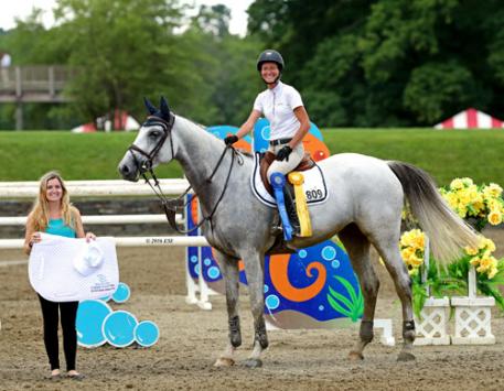 Molly Ashe accepting the awards for first and third aboard D'Arnita.