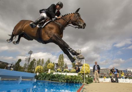 Nick Skelton of Great Britain riding Big Star goes over the water jump as they compete in the Furusiyya FEI Nations Cup™ Jumping Final 2016 Barcelona
