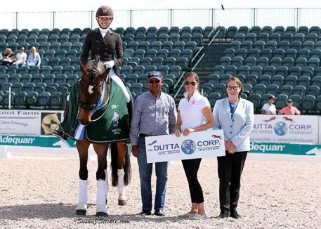 PJ Rizvi and Breaking Dawn in their presentation ceremony with Tim Dutta of The Dutta Corp, Cora Causemann of AGDF, and judge Evi Eisenhardt (GER). 