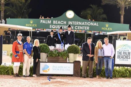 Kristen Vanderveen, Margie Engle, and Beat Mändli in their presentation ceremony with ring master Steve Rector; Scott Glinski, Marketing & Communications Manager of Palm Beach County Sports Commission; Beth & Keith Vanderveen; and Mark & Katherine Bellissimo of Wellington Equestrian Partners. 