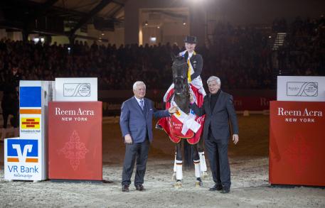 Reem Acra FEI World Cup™ Qaulifier Neumunster winner Isabel Werth Ulrich Kasselman and on right Paul Schockemohle