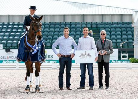 Steffen Peters and Rosamunde in their presentation ceremony with Craig Martin and Rob Desino of Wellington Equestrian Realty alongside judge Gary Rockwell. 