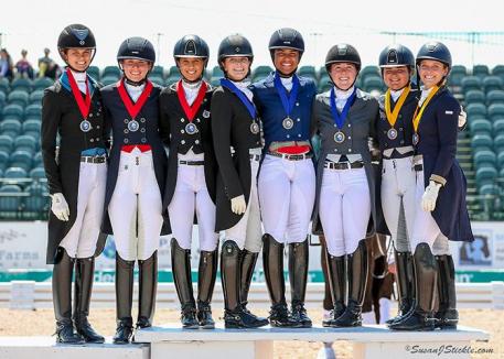 USA Team A, USA Team B, and Team Canada pose together atop the podium after receiving their medals in the inaugural FEI Under 25 Nations Cup CDIO 3* presented by Diamante Farms at the Adequan® Global Dressage Festival (AGDF). 