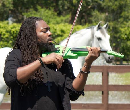 DSharp serenades a horse at Caroline Roffman’s Lionshare Dressage