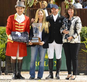  Laura Fetterman of Champion Equine Insurance, accompanied by ringmaster Gustavo Murcia, presents rider Eric Lamaze and owner Carlene Ziegler of Artisan Farms with the Champion Equine Insurance Overall Jumper Style Award for Fine Lady 5. Photo by Starting Gate Communications