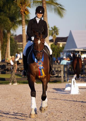 Faye Flynn of Eustis, Florida qualified at both First Level and First Level Freestyle (AA division) with her own 9-year-old Oldenburg gelding Rosevelt, winning her USDF Region 3 Championships class with a 78%.