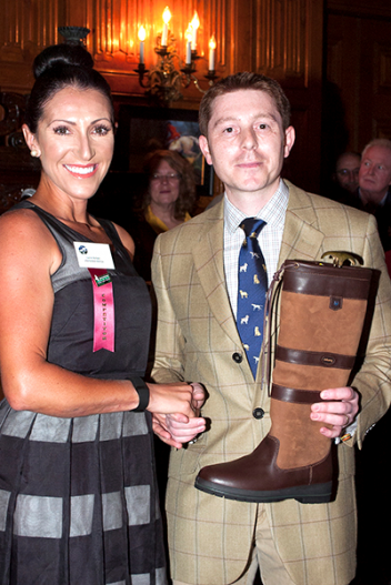 Danny Hulse (right) presents the Dubarry boots to Laine Ashker. (Michelle Dunn photo)