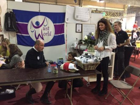 Laura Mathy and John Whitaker at the JustWorld booth. Photo: Courtesy of Client.