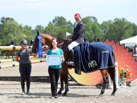Manuel Torres and Cinderella are presented with winner’s awards, including a Horze Equestrian cooler, after the $40,000 HITS Grand Prix presented by Zoetis. ©ESI Photography