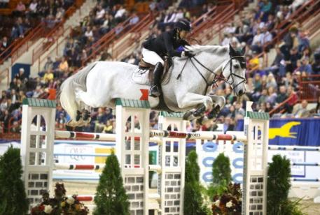 Margie Engle riding Indigo in her Equine Couture Stars & Stripes Breeches at the Pennsylvania National Horse Show. 