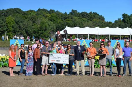 Representatives of HITS and Zoetis present top honors, including a Horseware Ireland cooler and $350,000 winner's check to Todd Minikus and Quality Girl. ©ESI Photography