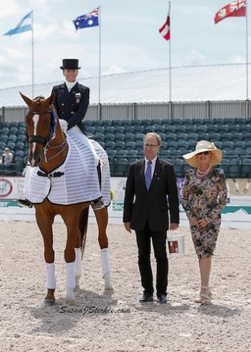 Lisa and Galant in their winning presentation with judge Bo Jena and Meryl Squires of Regal Horse Products.