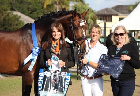 The Omega Alpha Healthy Horse, Abacus, stands (from left to right) with his owner Carol Cohen, his rider Hannah Michaels, and Patti Hanco of Omega Alpha Pharmaceuticals, Inc. 