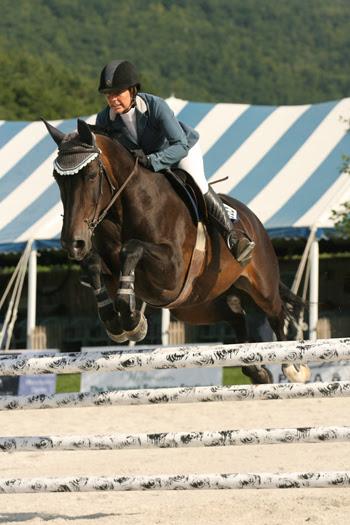 Alissa Kinsey closed out the 2014 Vermont Summer Festival in East Dorset, VT, by winning the 5,000 Child/Adult Jumper Classic, presented by Ariat, on August 10 with Grisset.  Photo by David Mullinix Photography