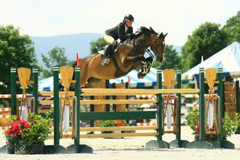 Amanda Flint topped the 0,000 Sir Ruly, Inc., Open Jumper Awards, to claim a $5,000 bonus at the 2014 Vermont Summer Festival in East Dorset, VT. Photo by David Mullinix Photography
