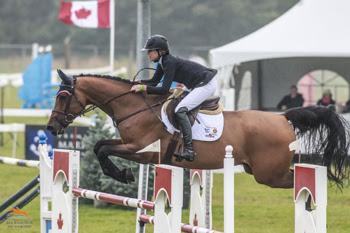 Amy Millar guides her new mount, Heros, to victory in the $50,000 Zucarlos Grand Prix, presented by Kubota Canada and Stewart’s Equipment, on August 16 at the CSI2* Orangeville Show Jumping Tournament in Orangeville, ON. Photo by Ben Radvanyi Photography