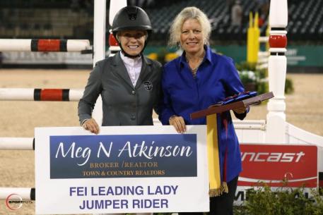 Amanda Derbyshire accepts the FEI Leading Lady Jumper Rider Award presented by Meg Atkinson of Town & Country Realtors.