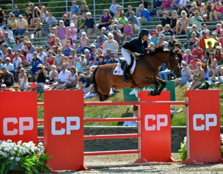 Beezie Madden, of Cazenovia, New York, and Abigail Wexner's Simon claim the CP  Million Grand Prix FEI CSI-5*, presented by Wells Fargo on September 6, 2015 at HITS-on-the-Hudson in Saugerties, New York. 