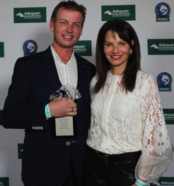 Carol Cohen (right) presents the Global Dressage Visionary Award to Olympian Carl Hester (left) at the Adequan Global Dressage Festival