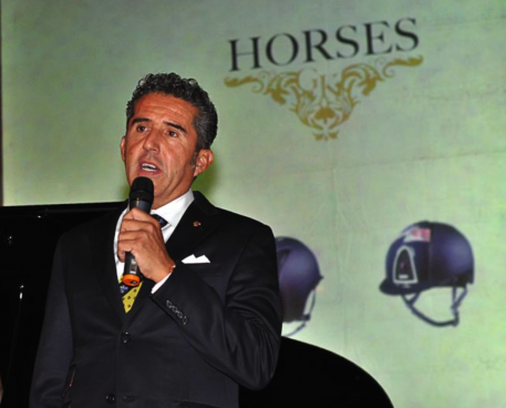 Dr. Cesar Parra speaks at the GK Horses ceremony in Florence, Italy