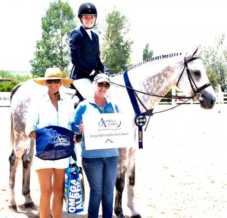Ceto II, trained by Julie Luzicka (right) and ridden by Hannah Wiggins, wins the Omega Alpha Healthy Horse Award at the Summer in the Rockies show series at the Colorado Horse Park