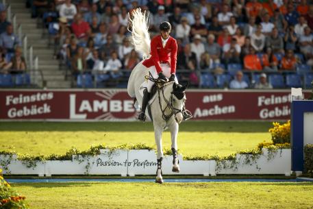 Daniel Deusser (GBR) and Cornet D Amour