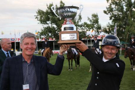 Eric Lamaze celebrates his second win on Wednesday with Cal Jacober, Office Managing Partner Western Canada, PWC. 