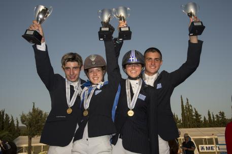   The newly-crowned Junior team gold medallists from Greece at the FEI Balkan Jumping Championships 2015 in Halkidiki, Sithonia, Greece last weekend. (L to R) Alexandros Kokkonis, Nikolina Makarona, Ioli Mytilineou and Konstantinos Papathanassiou. (Photo: FEI/Alexis Vassilopoulos)