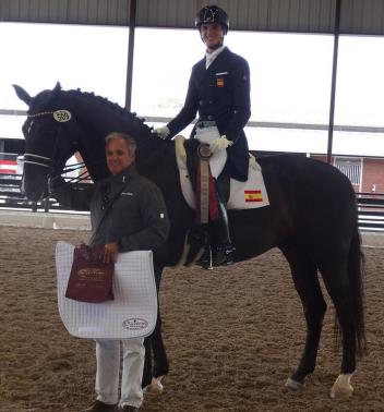 Juan Matute Jr. riding Dhannie Ymas is presented with the Custom Saddlery MVR Award at the Adequan Global Dressage Festival. Pictured with his father, dressage Olympian Juan Matute.
