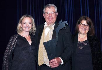 Owners Augustin and Christine Walch accept the award on behalf of Rio Grande, who was inducted into the Jump Canada Hall of Fame in the category of Jumper Horse, from presenter Erynn Ballard (left).